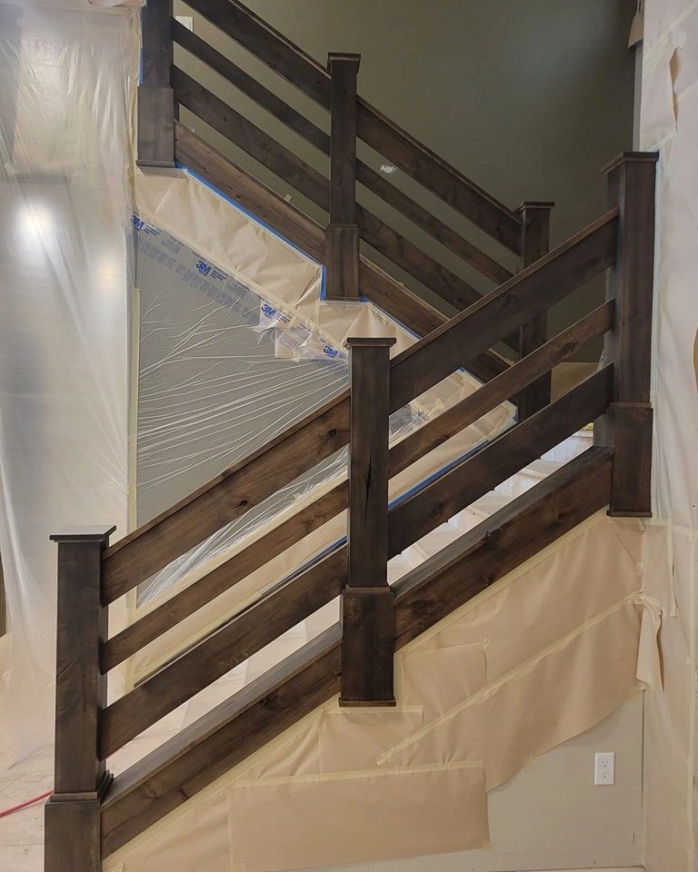 Stained stairway rails.