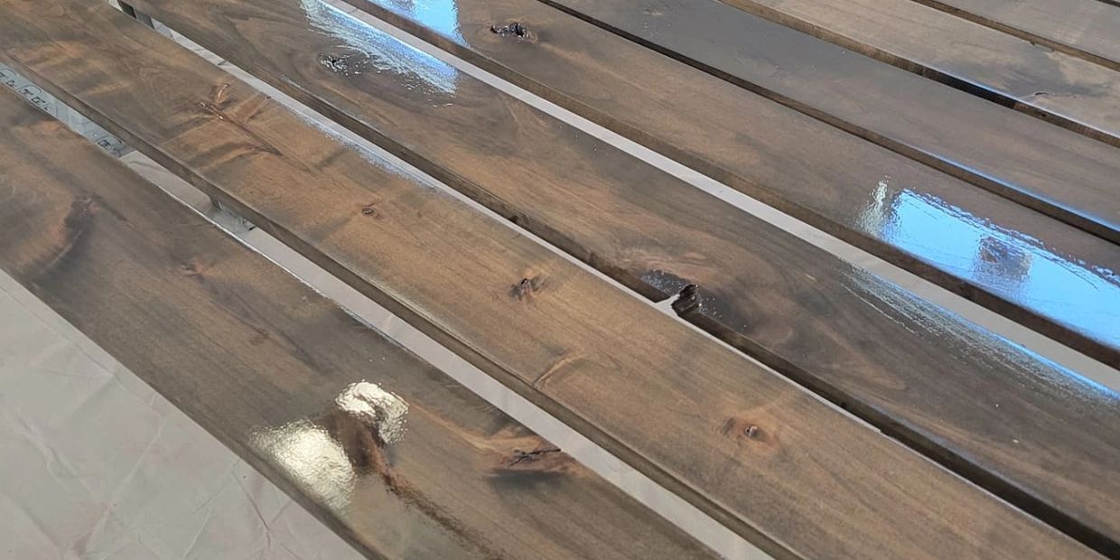 Wood slats that are stained and lacquered with a high sheen.