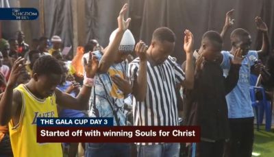 Young people praying at a Christian event.