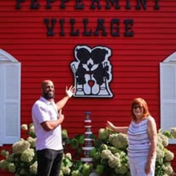 Two people showing their business