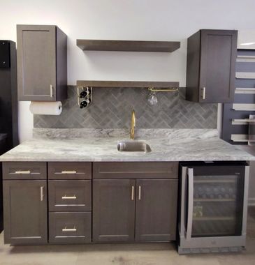 Bar Area:Cabinets in Beachwood color, floating shelves, glass and wine racks, GE undercabinet fridge.