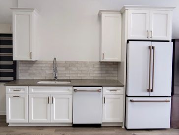 Cabinets in Snow Color with Ge Cafe Matte White Appliances.