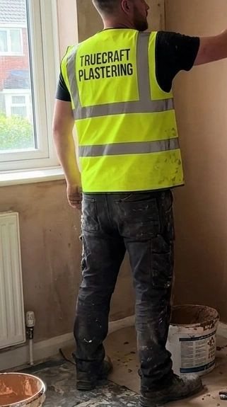 Truecraft Plastering wall skimming work in Glasgow — Cee applying fresh plaster