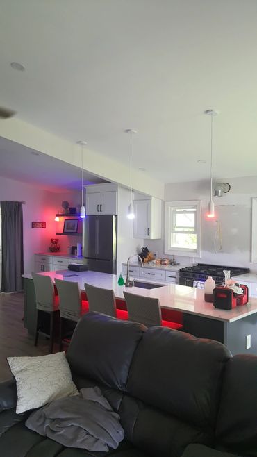AI Smart Lighting Installation with recessed, pendant and smart color accent lighting.