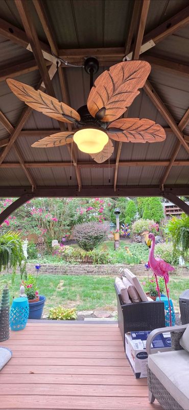 Outdoor fan and light combo installation with weather rated mounting and clean finish.