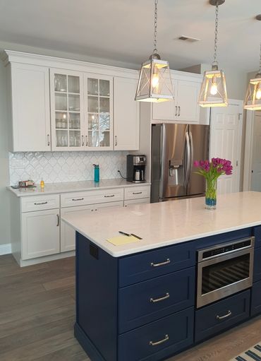 Kitchen island pendant lighting installation with precise alignment and clean professional finish.