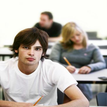 Teens learning to drive with 32 class hours of drivers ed instruction.