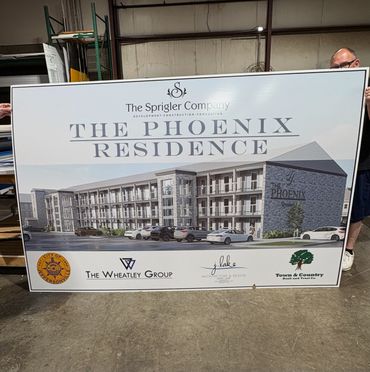 Signboard showing architectural design for The Phoenix Residence by The Sprigler Company.
