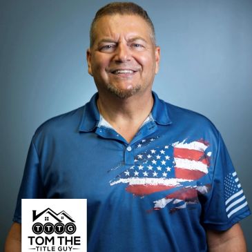 Man in patriotic American flag shirt smiling.