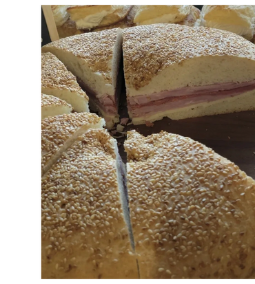 Muffuletta a must-have Sicilian sandwich! Soft fluffy homemade bread topped with toasted sesame see