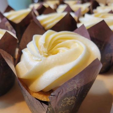 Our tender Vanilla Bean cupcakes, topped with Italian Buttercream