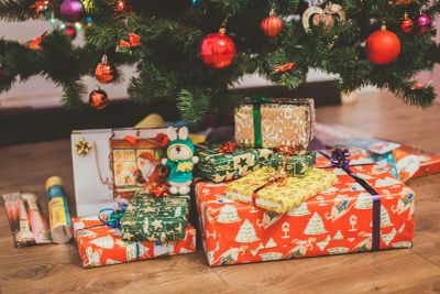 Christmas presents under a decorated tree.