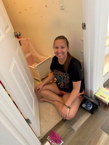 Kelli from Declutter Zone ready to organize a toy storage closet.
