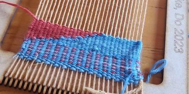 A frame loom that is partially woven