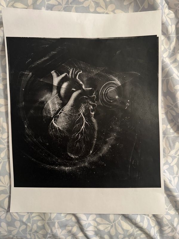 alt="Black-and-white print of a realistic heart and swirling patterns on paper held at one corner"
