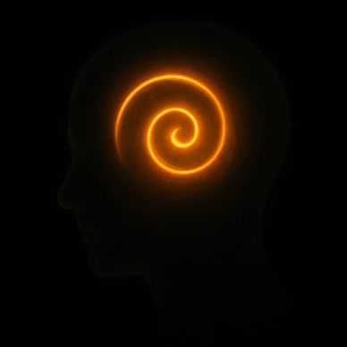 alt="A golden spiral ember glowing inside a translucent head silhouette against deep black."
