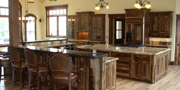 Custom reclaimed oak barnwood kitchen cabinets Lakeside Montana. Old world style with granite tops