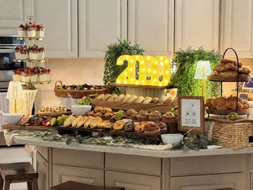 Elegant buffet setup with various breads and treats.