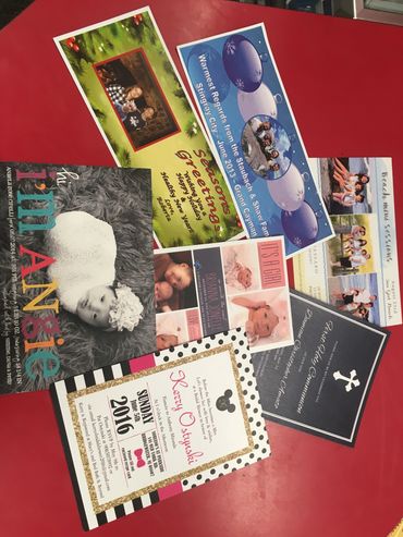 Assorted printed cards and photos.