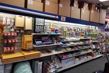 Shelves inside a printing shop.