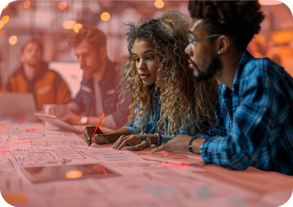 Two people review papers and sticky notes, representing measuring results and planning improvements.