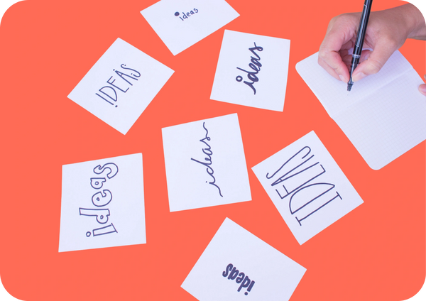 Sticky notes labelled ideas, representing first stage to turn ideas to action through clarity.