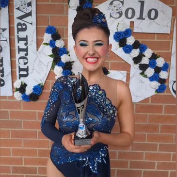 calisthenics dancer recieving award from dance comp