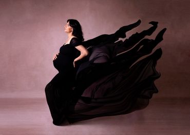 beautiful pregnant lady in flowing black gown