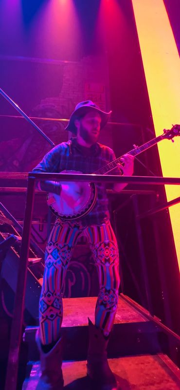 rock and roll banjo player on stage