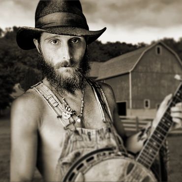 banjo player with a barn
