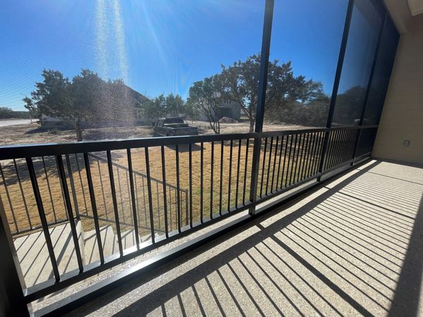 Side profile of handrail system on a patio enclosure