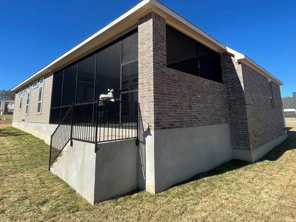 Outside view of a patio enclosure installed in San Antonio, Texas