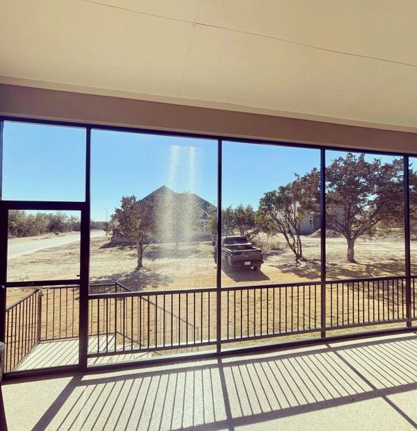 Inside view of a screen room with handrail system