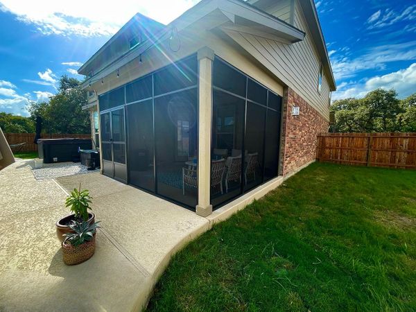 Patio enclosure was designed and installed in Helotes, Texas