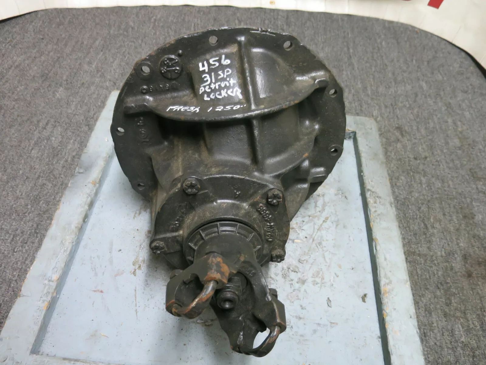 Rebuilt 9" 31 Spline Detroit Locker carrier assembly. It is set up with 4.56:1 gears