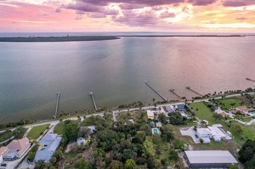 Real Estate Aerial Photography showing the surrounding areas beach