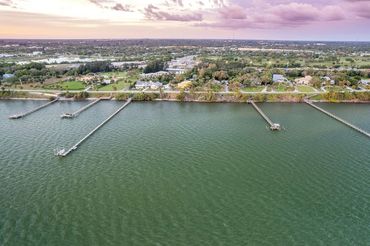 Real Estate Aerial Photography showing the surrounding areas beach