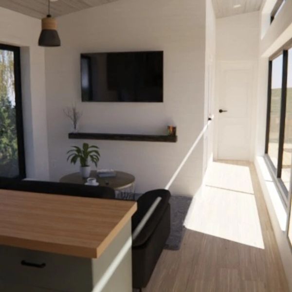Minimalist living room with natural light and modern decor.