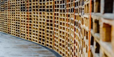 Durable Grade B pallets with visible repairs for heavy loads