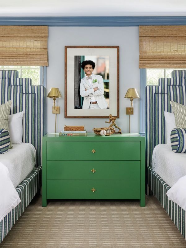 Framed senior portrait displayed in a stylish bedroom by Minneapolis photographer Elissa Bean.
