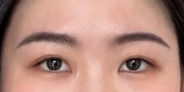 Close-up of a person's eyes and eyebrows.