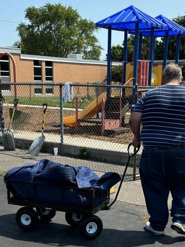 Volunteers helping spread mulch & Pea Gravel