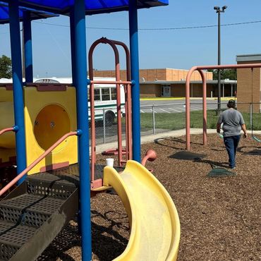 Volunteers helping spread mulch & Pea Gravel