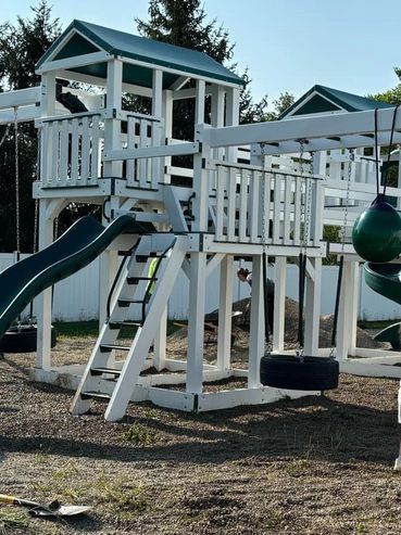 Volunteers helping spread mulch & Pea Gravel