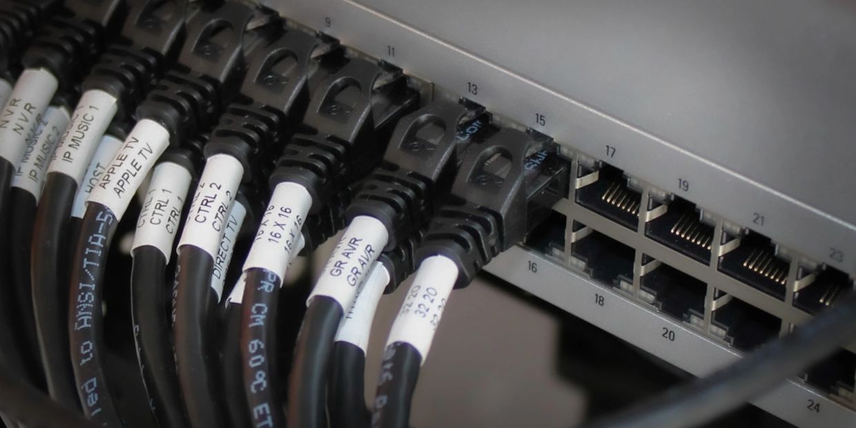 Ubiquiti network switch with several patch cables connected