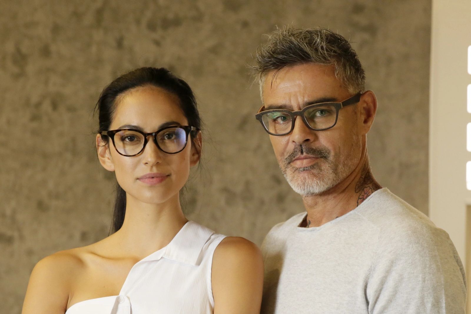 Man and woman wearing custom made eyeglasses