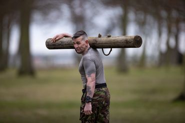 Pete carrying a log.