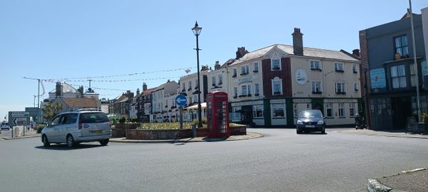 Red telephone box on a roundabout in Deal.