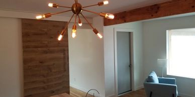 Fixtures, farmhouse door & wood floors in renovated home - Allegiance Residential Inspections of Texas 
