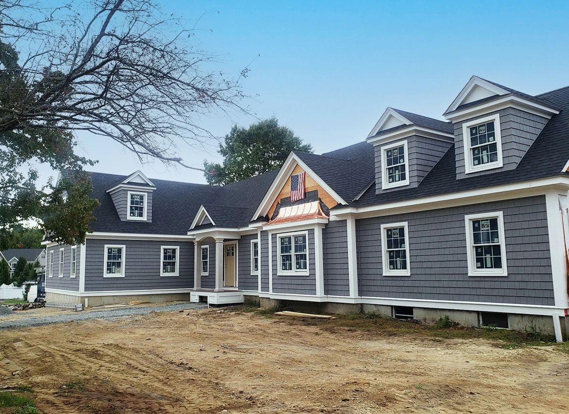 Stunning home in Bedford MA with new asphalt roof, siding, windows, gutters and copper trim